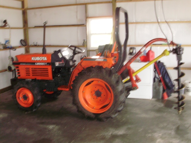 My tractor and post hole digger I loaned my friend
